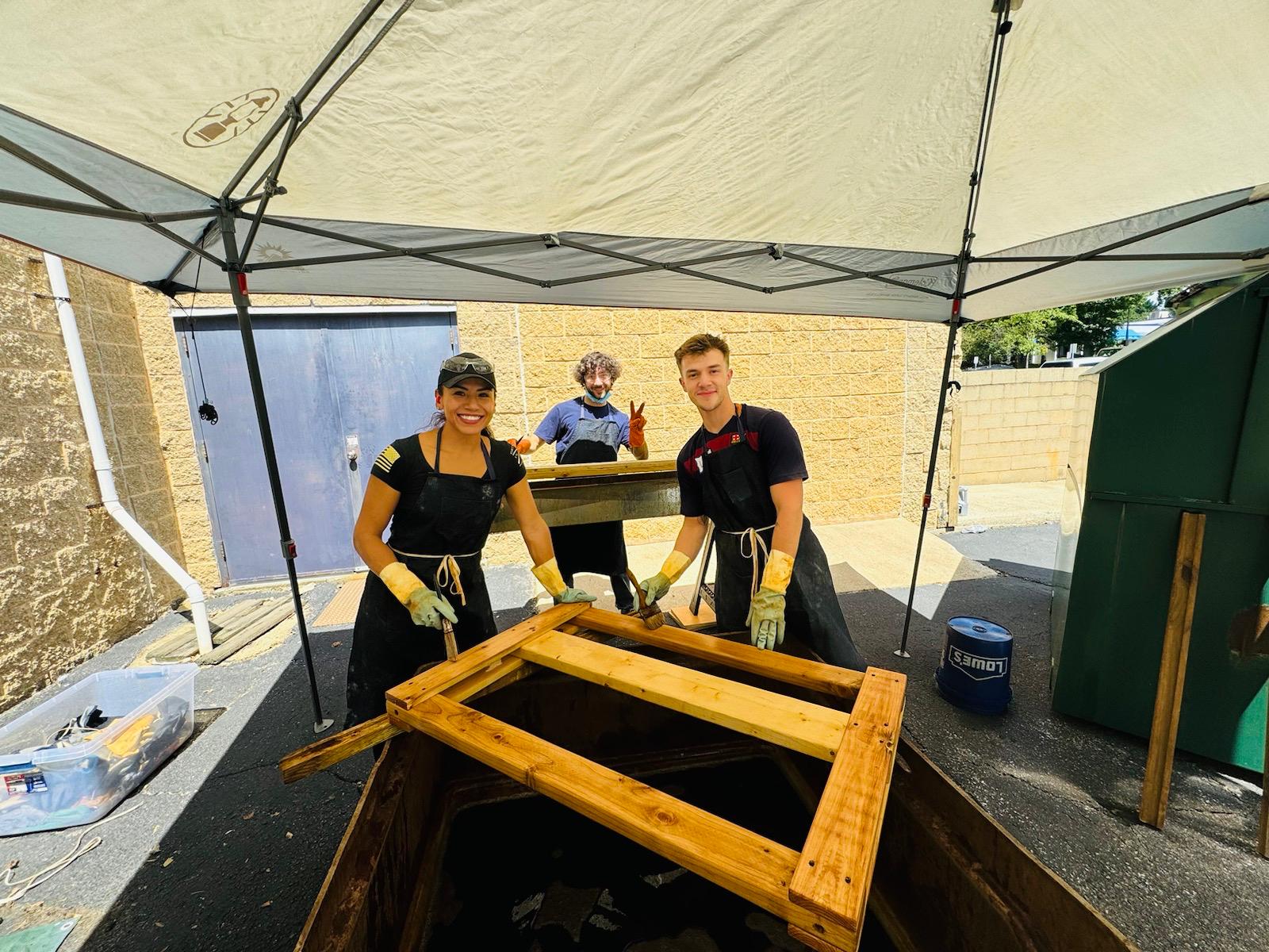 Volunteers building beds for kids